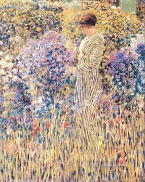 Dama en un jardín Mujeres impresionistas Frederick Carl Frieseke Pinturas al óleo